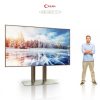 Giant cinema smart TV with a pure stainless steel floor stand.