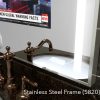 Sleek and elegant stainless steel framed bathroom vanity mirror TV.