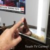 Touch controlled bathroom vanity mirror TV.